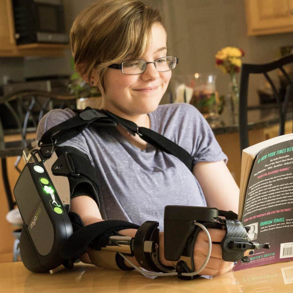 MyoPro Upper Limb Rehabilitation – Patient Reading Using MyoPro Patient reading while using a MyoPro upper limb orthosis