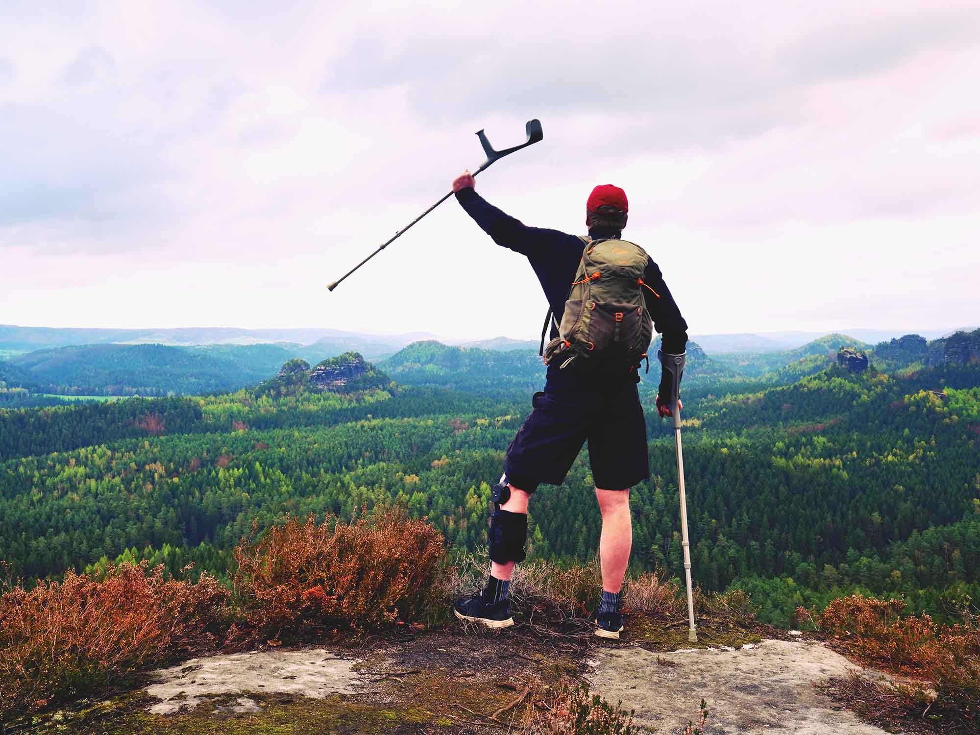 OPCA Parker Orthotic Prosthetic Care – At the top of a trail Patient with a prosthetic leg overlooking a mountain trail