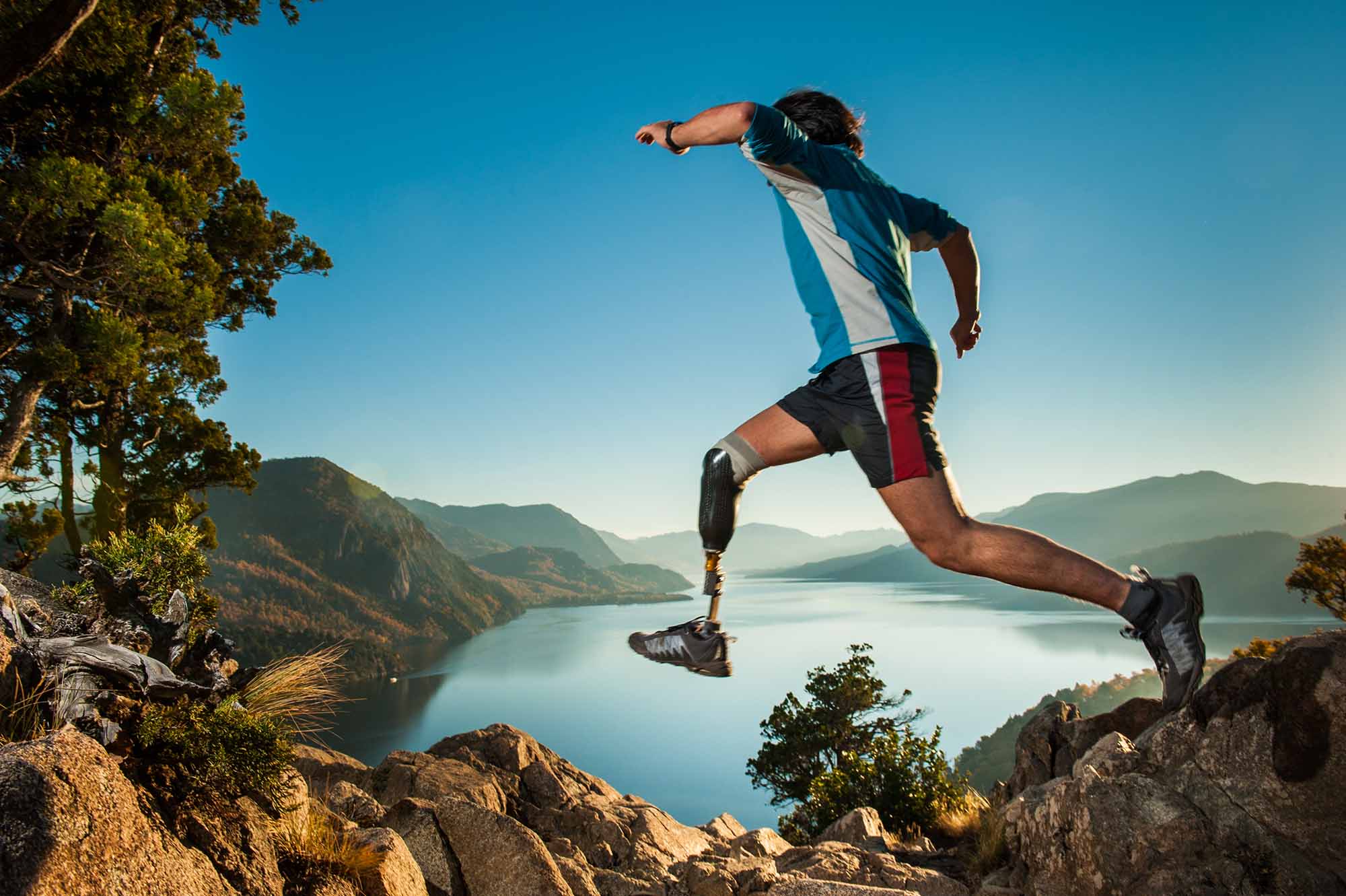 OPCA Parker Orthotic Prosthetic Care – Prosthetic Leg Jumping Across Rock trail Patient using a prosthetic leg while crossing a rocky trail